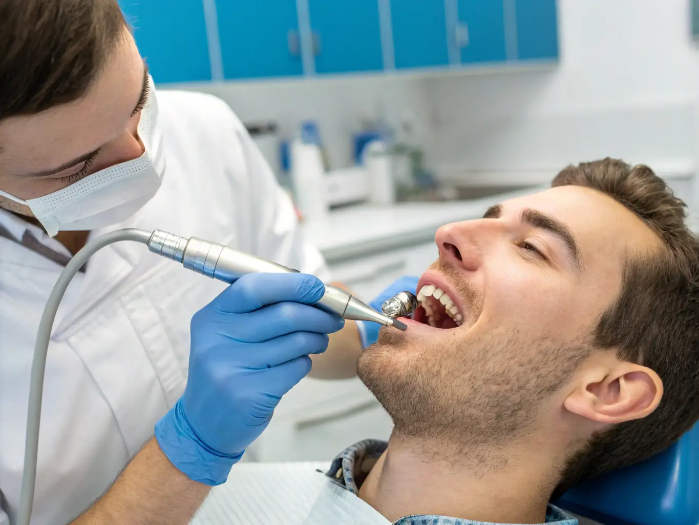 A dentist performing a dental restoration procedure, such as filling a cavity, using advanced dental materials and technology in a comfortable dental suite.